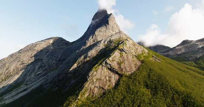 Stetind Mountain With Its Distinctive Obelisk-shape Against Blue Sky In Northern Norway. - tilt up shot