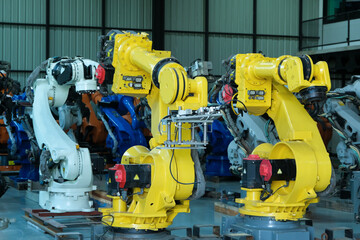 Many industrial robot arms are ready to be installed on automated production lines of modern automobile factory.
