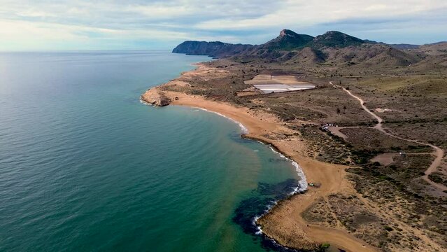 Calblanque coast aerial drone view point of coastline of mountains against mediterranean seascape in Cartagena coasts, Spain.