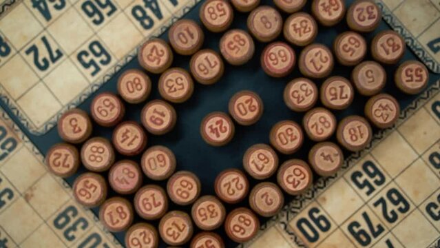 Cinematic close-up smooth shot from above of a pile of Bingo wooden barrels in a square, woody figures, old numbers background, vintage board game, slow motion 120 FPS commercial rotating zoom in