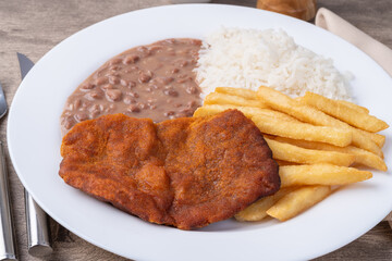 Milanese beef, rice, beans and french fries. Typical brazilian executive dish