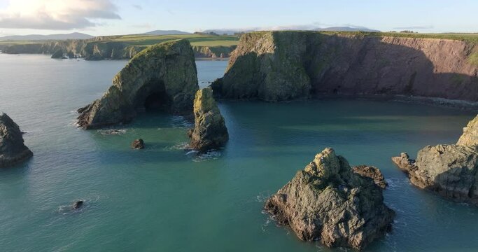 Drone fly over sea Stacks sea caves and hidden beach Copper Coast Waterford Ireland natures beauty