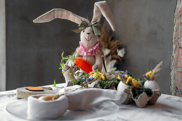 Happy Easter day. Easter card, background. Preparation for Easter. Serving, Flowers, toys. decorated table, handmade decorations for the holiday Easter. Eggs, hare