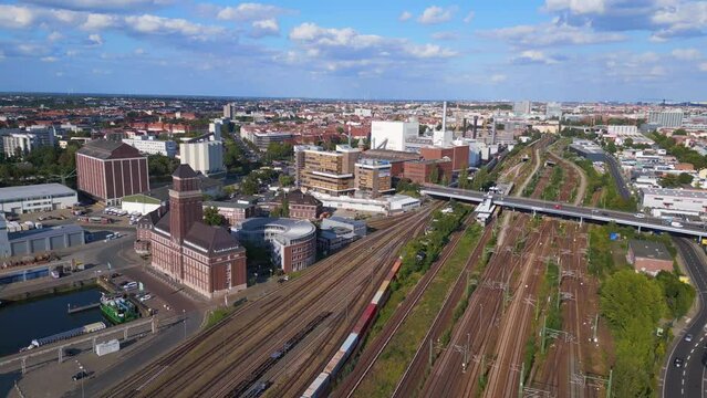 Bridge station train suburban railroad Tracks Berlin. Gorgeous aerial top view flight overflight flyover drone

4k footage