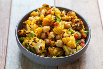 Vegan salad with chickpea, roast cauliflower and avocado