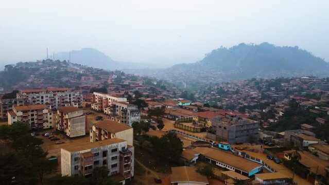 Aerial view over apartment buildings in the suburbs of hazy Yaounde, Cameroon