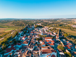 Above Óbidos: Aerial Vistas of the Enchanting Portuguese Village Nestled Amidst Historic Walls and Lush Greenery