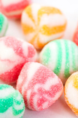 Mixed pastel colored jelly sweets covered in sugar. Selective focus