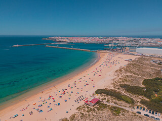 Nazaré Reverie: A Mesmerizing Aerial View of Atlantic Waves Embracing Golden Shores