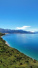 Fototapeta na wymiar Aerial view of Lake Hawea surrounded by lush greenery. New Zealand