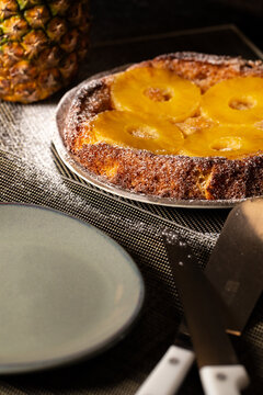 Pineapple Cake ready to eat, verticaol image with a dark background, Portugal.