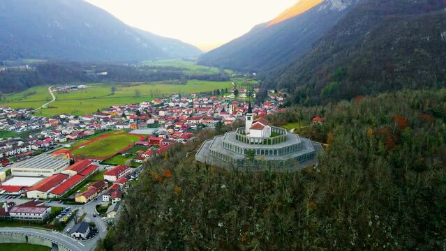 Aerial 4K drone footage captures the majestic Church of Saint Anthony, Kobarid- Slovenia. This landmark is dedicated to the memory of the fallen soldiers from World War I. Filmed in late autumn.