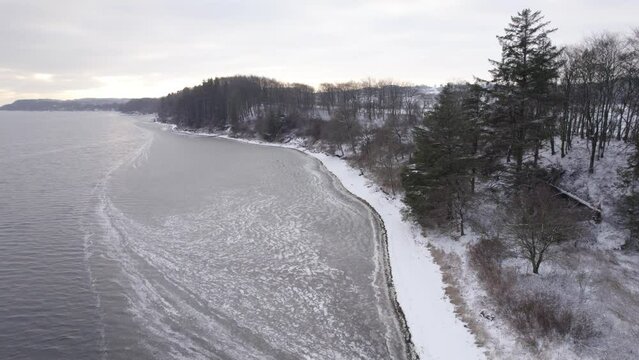 Icy Shore of the Limfjord In Denmark Under The Snow - Aerial Shot
