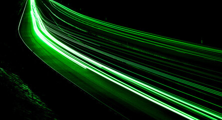 green car lights at night. long exposure