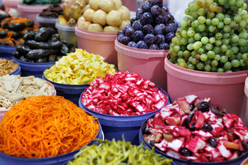 A large selection of various canned vegetables at the farmer's market.