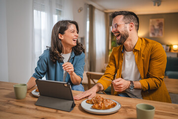 adult happy couple man and woman shopping online hold credit card