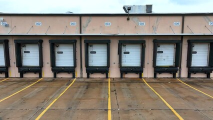 Industrial loading dock at a warehouse. Aerial truck shot of empty cargo center.