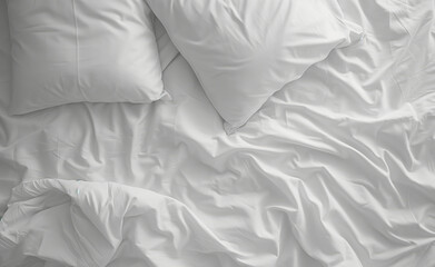 White pillows and white duvet lay on the bed with the rays of the morning sun hitting it