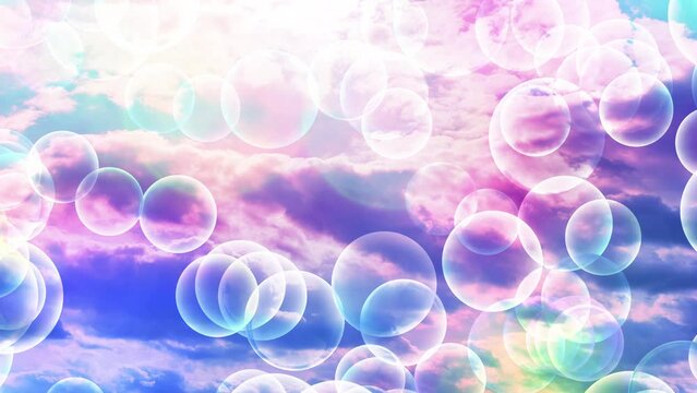 Transparent bubbles rise up and increase in size against a colorful rainbow sky. Beautiful romantic concept background. Valentine day, Happy Birthday, Holiday, Wedding Anniversary, Marriage, Love. 4K