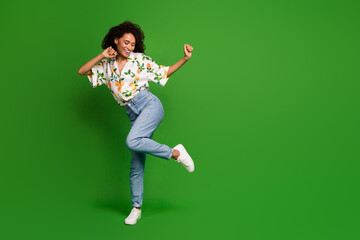 Photo of positive cheerful millennial girl dancing energetic in party event isolated bright color background