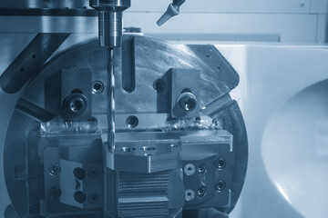 The 5-axis CNC milling machine  hole making the automotive part with drill tool.