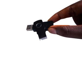 hand holding a flash drive