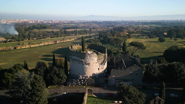 Mausoleum of Cecilia Metella, Orbiting Drone Shot along Via Appia Antica. Rome, Italy