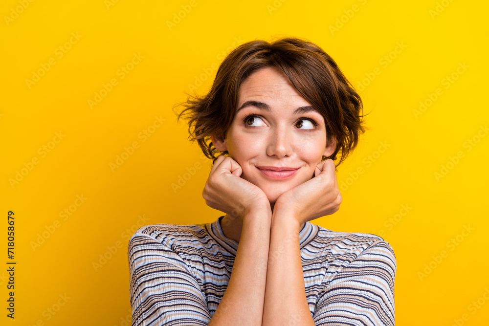 Poster Close up photo of adorable lovely girl two arms touch face look empty space offer banner isolated on yellow color background