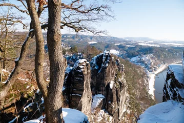 Photo sur Plexiglas Le pont de la Bastei famous Bastei in saxony covered with snow. Saxon Switzerland. January 2024