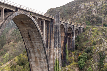 A Ponte Ulla, Spain. The viaduct of Gundian, a stone and iron rail bridge over the river Ulla