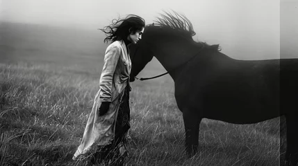 Fotobehang Young woman in black dress with her black horse outdoor. © hugo