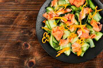 Fresh fish salad with raw cucumber.