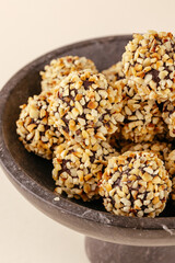 handmade chocolates made of chocolate and nuts on a pink backgro