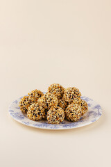 handmade chocolates made of chocolate and nuts on a pink backgro