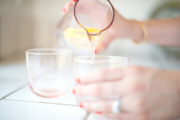 Woman pouring water in cup