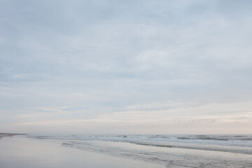 Fototapeta na wymiar A calm day at Atlantic Beach with calm waves