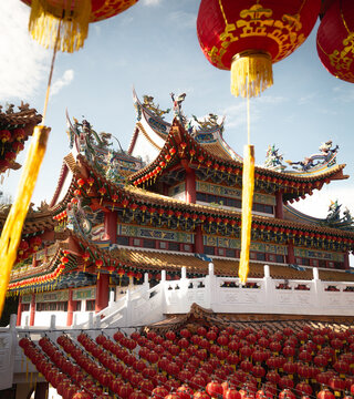 Red lanterns hanging at the Thean Hou Temple during sunrise
