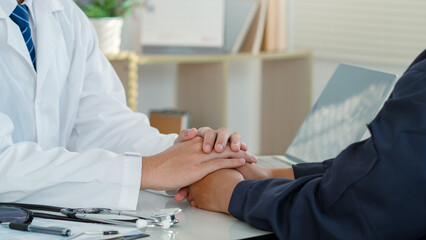 Health care concept.The doctor hold hands patient, giving empathy, comfort, psychological support,...