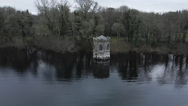 Temple at Lough Key, an old lakeside structure in Roscommon, Ireland, surrounded by trees