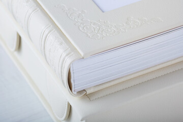 Detail of Wedding photobook and box in white leather binding. Wedding photo book, album family...