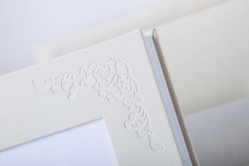 Detail of Wedding photobooks in white leather binding. Wedding photo book, album family album....