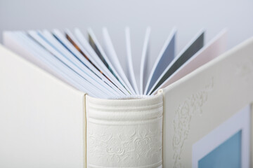 Detail of Wedding photobooks in white leather binding. Wedding photo book, album family album....
