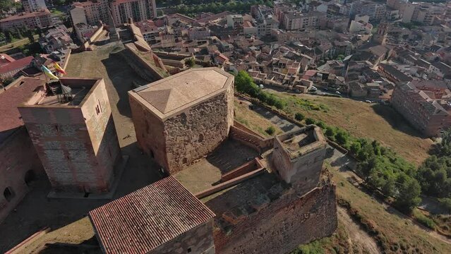 Historic Templar Castle in Monzon, Huesca with surrounding town, sunny day, aerial view