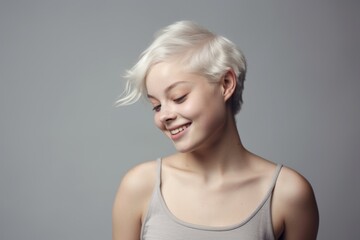 Studio beauty portrait of a smiling confident woman