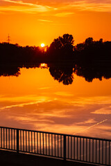 Sunset with reflections near Plattling, Isar, Deggendorf, Bavaria, Germany
