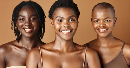 Foto op Canvas Happy, face or natural models with beauty, glowing skin or afro isolated on brown background. Facial dermatology, black women or skincare cosmetics in studio with girl friends or proud African people © N F/peopleimages.com