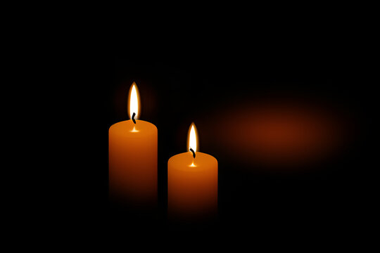 Two Burning Candles in the black darkness for somber spiritual enlightenment, hope, faith and warm emotions concept