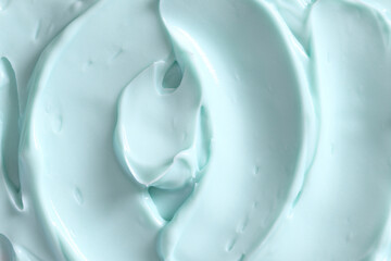 Fototapeta na wymiar Blue skin care cosmetic beauty cream texture background in close up