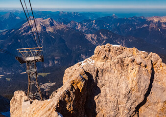 Alpine summer view with a cable car support at Mount Zugspitze, Top of Germany,...