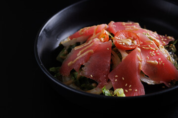 Japanese salad isolated in black background